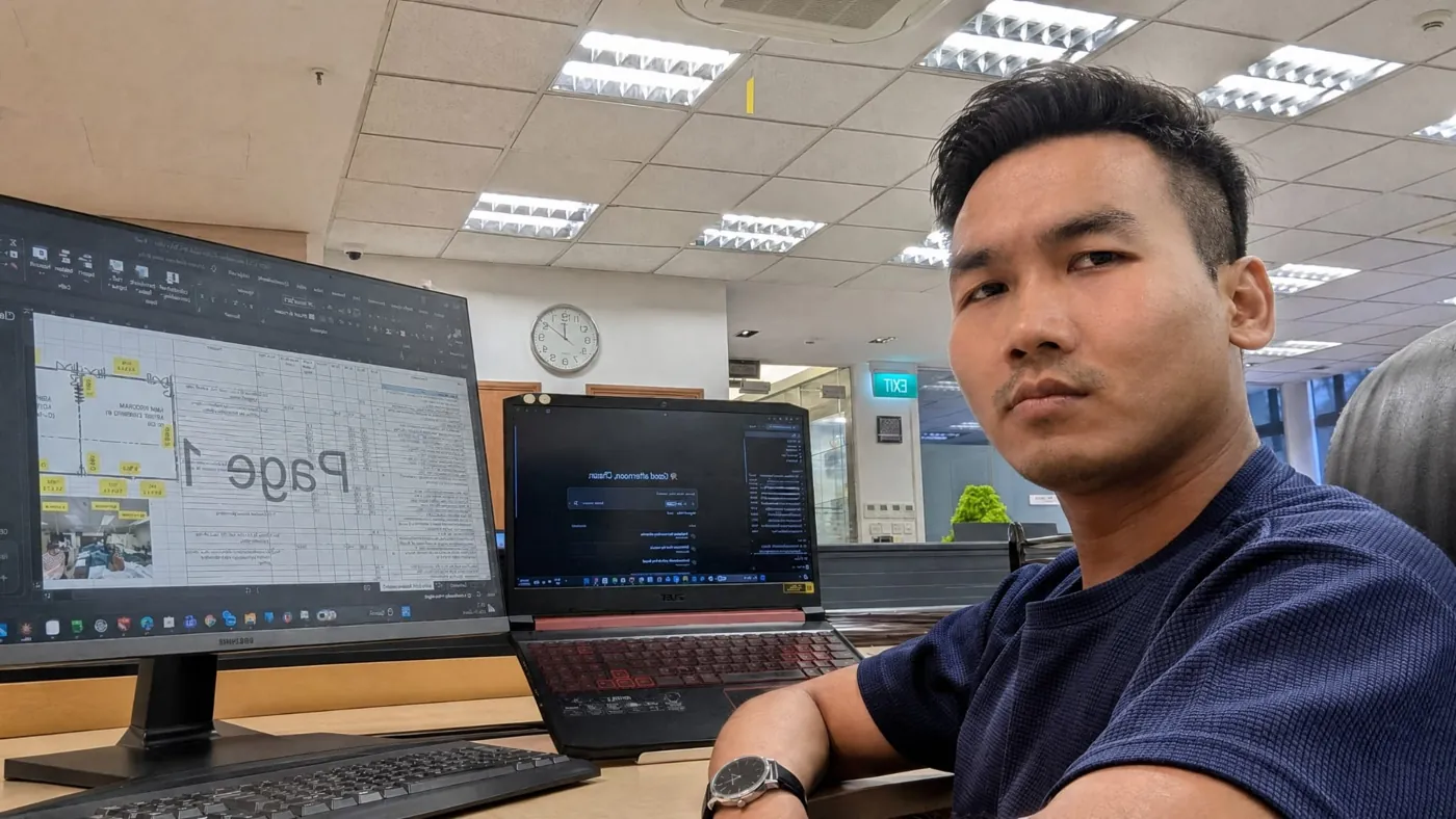 Thura at his desk